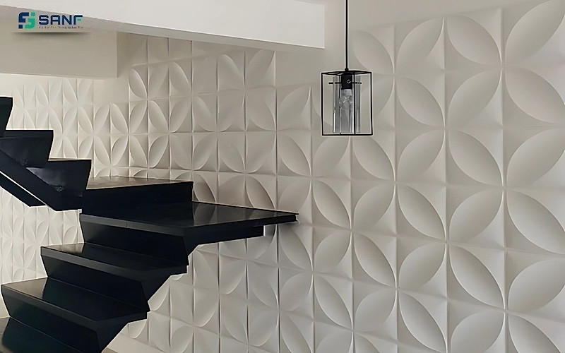 Vách tấm 3D họa tiết cánh hoa trắng cạnh cầu thang bậc đen và đèn thả